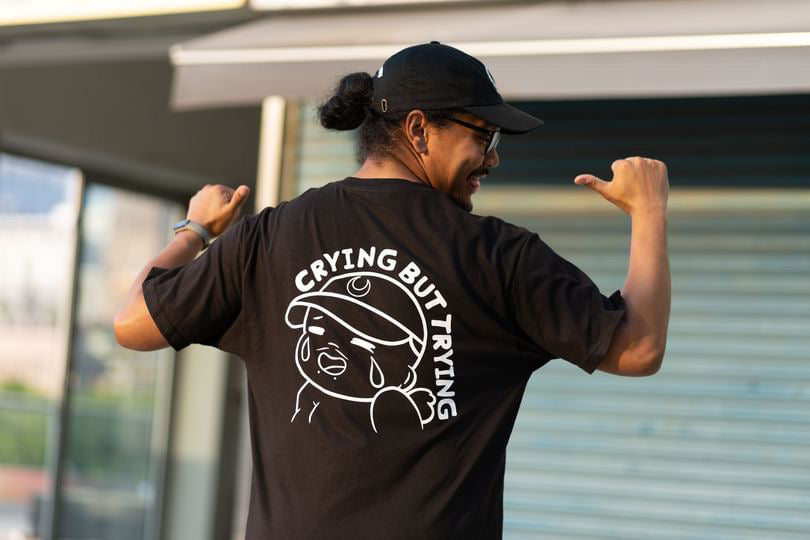 Discover Diazable's 'Crying But Trying' Kewpie clothing, blending millennial humor with unique designs. Based in San Antonio, Texas, our small business brings top-quality apparel to fans in Texas and Korea. Embrace your style with Diazable.